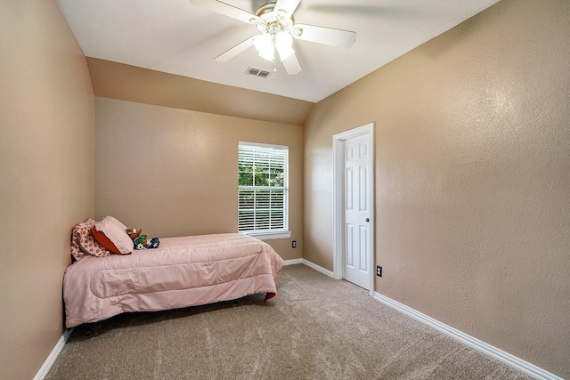 9513 Tiger Dr, Plano, TX 75025 - carpeted bedroom featuring a textured wall, ceiling fan, and lofted ceiling