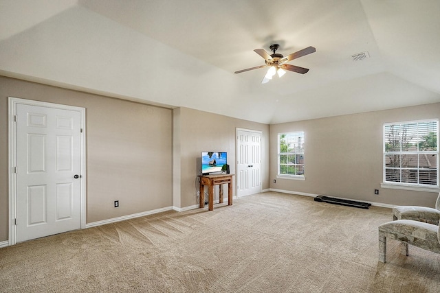 9513 Tiger Dr, Plano, TX 75025 - living area featuring carpet flooring, vaulted ceiling, and ceiling fan