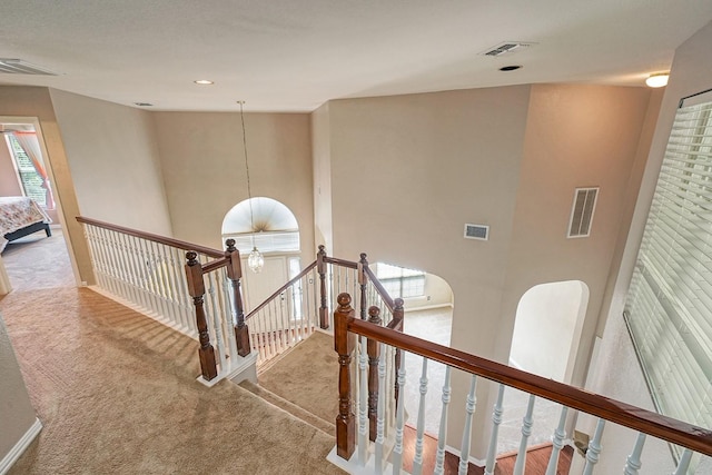 9513 Tiger Dr, Plano, TX 75025 - stairs featuring carpet floors, healthy amount of natural light, and a high ceiling