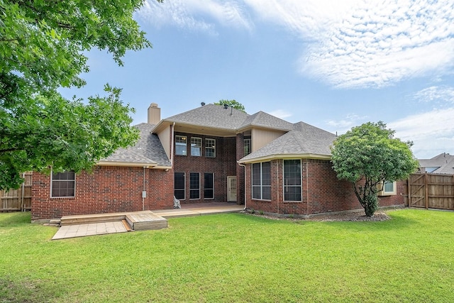 9513 Tiger Dr, Plano, TX 75025 - back of property featuring brick siding, roof with shingles, a patio area, and a chimney