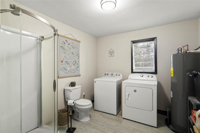 1054 Frontage Rd, Minden, LA 71055 - washroom with electric water heater and washer and clothes dryer