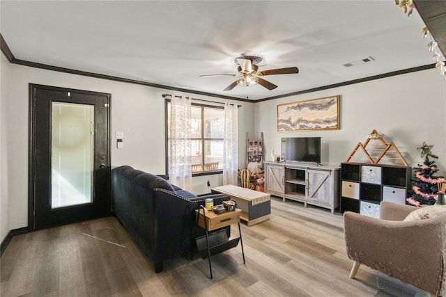 1054 Frontage Rd, Minden, LA 71055 - living area featuring ornamental molding, ceiling fan, and light wood-style flooring