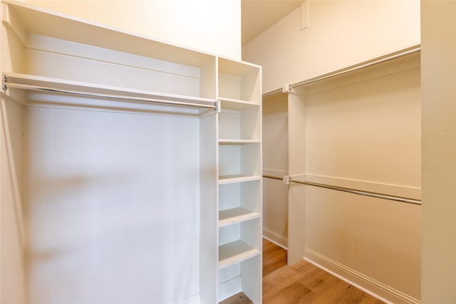 2203 N Carroll Ave Unit 1, Dallas, TX 75204 - walk in closet with light wood-type flooring