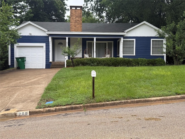 709 Highland Dr, Palestine, TX 75801 - ranch-style house with a garage, concrete driveway, a chimney, a front yard, and a porch