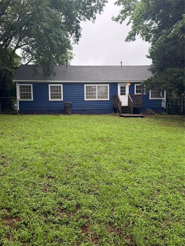 709 Highland Dr, Palestine, TX 75801 - rear view of house with crawl space and roof with shingles