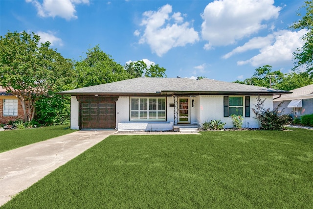 632 Sherwood Dr, Richardson, TX 75080 - ranch-style home with concrete driveway, an attached garage, a front lawn, roof with shingles, and brick siding