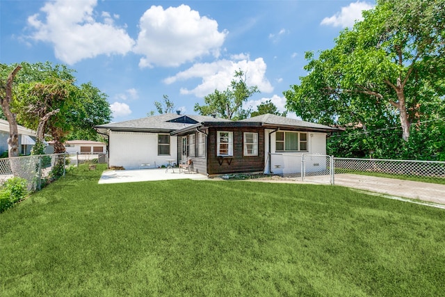 632 Sherwood Dr, Richardson, TX 75080 - back of property featuring a patio, a fenced backyard, and brick siding
