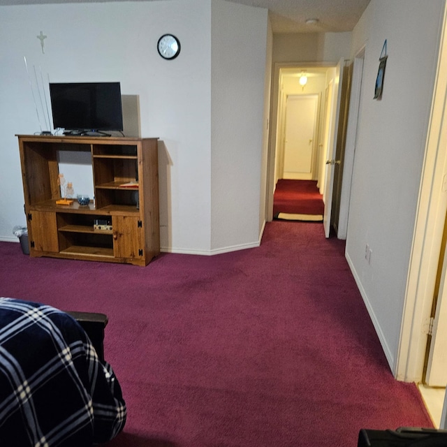 1026 Mazourka Dr, Arlington, TX 76001 - living area with dark colored carpet and baseboards