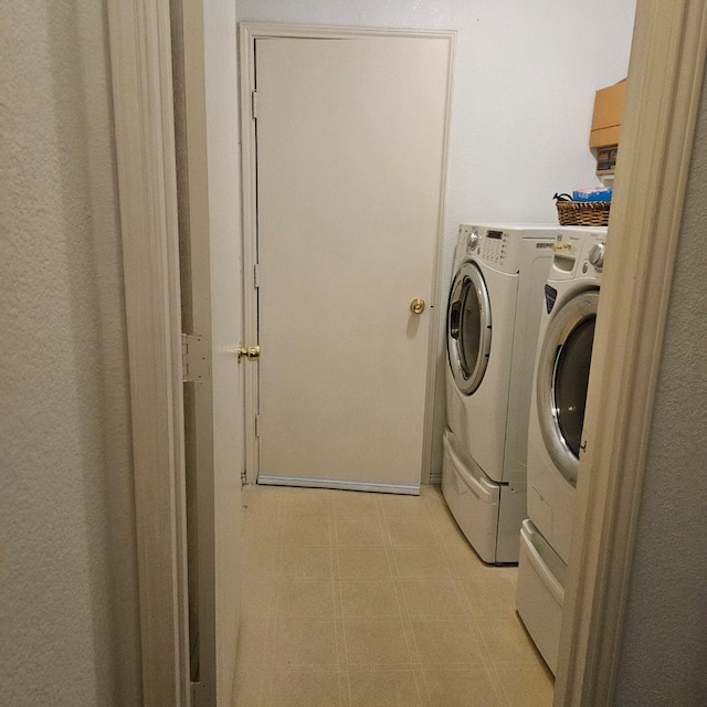 1026 Mazourka Dr, Arlington, TX 76001 - washroom featuring washer and dryer and light floors