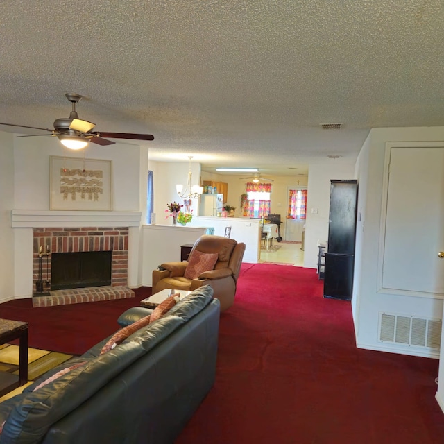 1026 Mazourka Dr, Arlington, TX 76001 - living room with a ceiling fan, carpet floors, a textured ceiling, and a fireplace