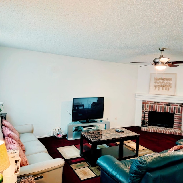 1026 Mazourka Dr, Arlington, TX 76001 - living area featuring a textured ceiling, ceiling fan, and a fireplace
