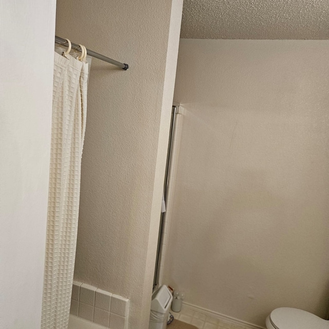 1026 Mazourka Dr, Arlington, TX 76001 - bathroom featuring toilet and curtained shower