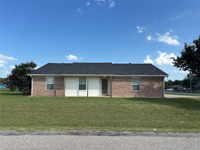 4052 Country Meadows Cir, Granbury, TX 76049 - view of front of property with a front yard, brick siding, and a shingled roof