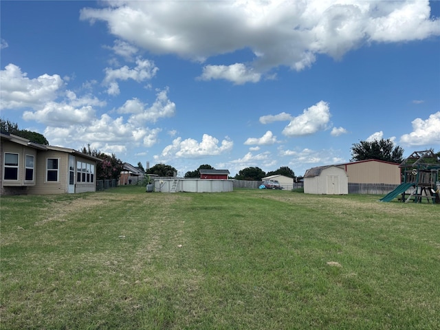 4052 Country Meadows Cir, Granbury, TX 76049 - view of yard with a storage shed and a playground
