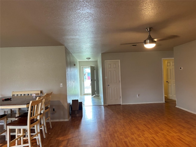 4052 Country Meadows Cir, Granbury, TX 76049 - dining area featuring wood finished floors, a ceiling fan, and a textured ceiling
