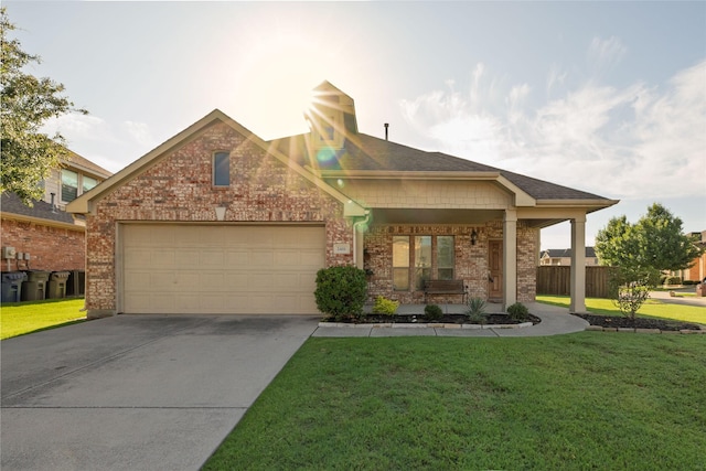 2401 Fawn Meadow Dr, Little Elm, TX 75068 - craftsman house featuring brick siding, a garage, concrete driveway, and a porch