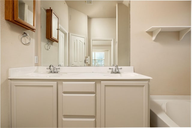 2401 Fawn Meadow Dr, Little Elm, TX 75068 - bathroom with double vanity and a garden tub