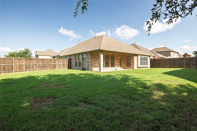 2401 Fawn Meadow Dr, Little Elm, TX 75068 - rear view of property with brick siding and a fenced backyard