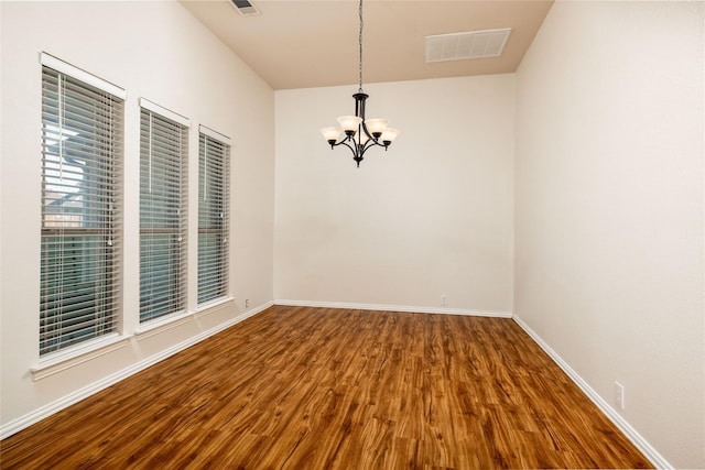 2401 Fawn Meadow Dr, Little Elm, TX 75068 - spare room featuring a chandelier and wood finished floors