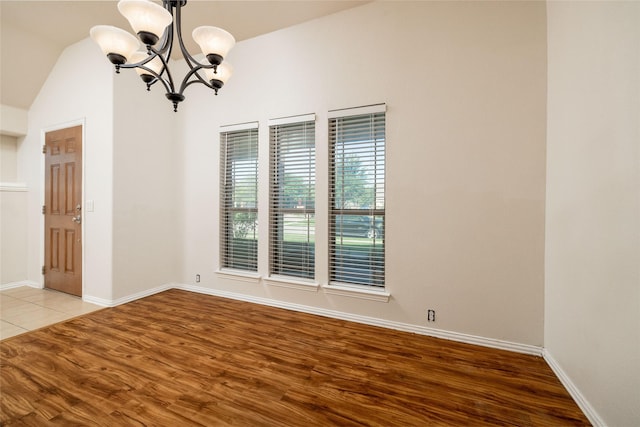 2401 Fawn Meadow Dr, Little Elm, TX 75068 - empty room with a chandelier and wood finished floors