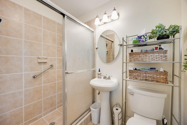 13835 Pyramid Dr, Farmers Branch, TX 75234 - bathroom featuring a shower stall and toilet