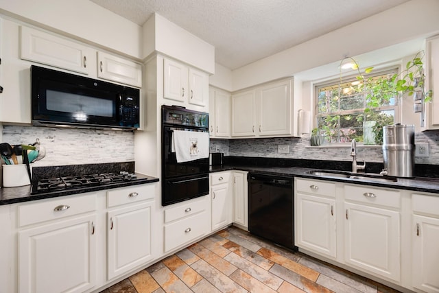 13835 Pyramid Dr, Farmers Branch, TX 75234 - kitchen featuring black appliances, a warming drawer, dark countertops, decorative backsplash, and white cabinetry