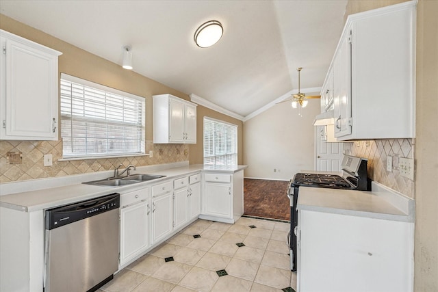 5219 Tennis Villa Dr, Arlington, TX 76017 - kitchen featuring stainless steel appliances, lofted ceiling, white cabinetry, tasteful backsplash, and light countertops