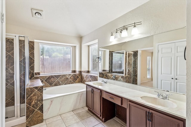 5219 Tennis Villa Dr, Arlington, TX 76017 - full bath featuring a bath, a stall shower, double vanity, and tile patterned floors