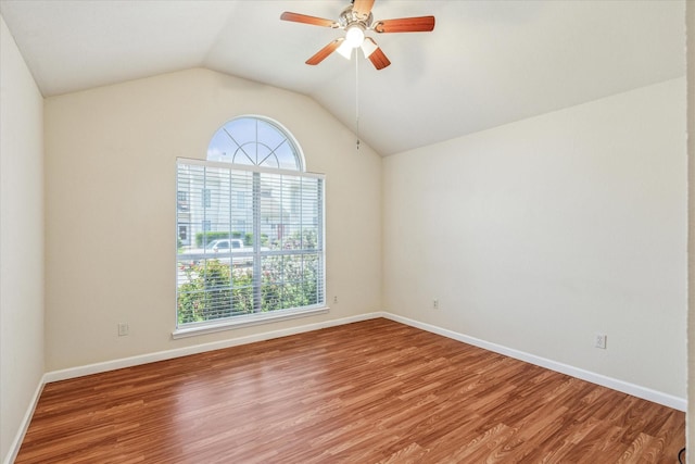 5219 Tennis Villa Dr, Arlington, TX 76017 - empty room with wood finished floors, a ceiling fan, and vaulted ceiling