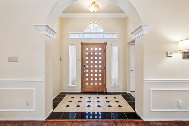 5219 Tennis Villa Dr, Arlington, TX 76017 - entryway featuring arched walkways, ornamental molding, and tile patterned floors
