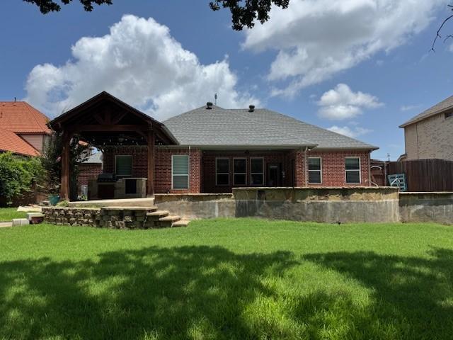 3840 W Pioneer Dr, Irving, TX 75061 - rear view of house featuring brick siding, a gazebo, and a patio area