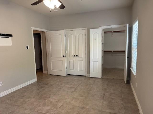 3840 W Pioneer Dr, Irving, TX 75061 - unfurnished bedroom with two closets and a ceiling fan