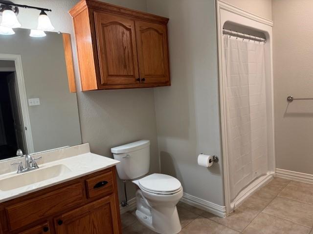 3840 W Pioneer Dr, Irving, TX 75061 - full bath featuring vanity, tile patterned floors, and a shower with shower curtain