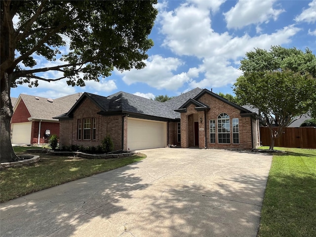 4400 Ripplewood Rd, Frisco, TX 75035 - ranch-style house with brick siding, a garage, driveway, and roof with shingles