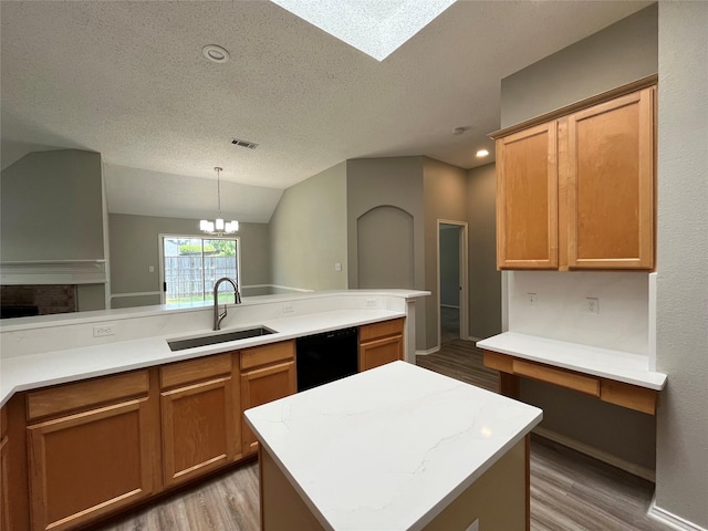 4400 Ripplewood Rd, Frisco, TX 75035 - kitchen with black dishwasher, light wood-type flooring, a textured ceiling, light countertops, and a chandelier