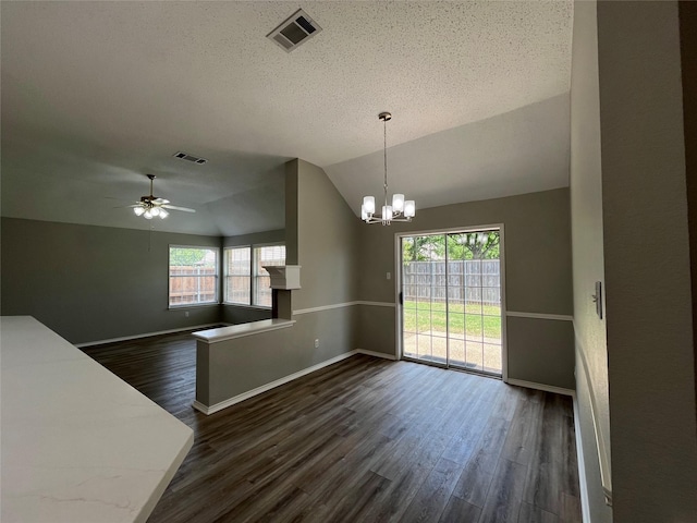 4400 Ripplewood Rd, Frisco, TX 75035 - unfurnished dining area featuring dark wood-style floors, vaulted ceiling, a chandelier, a textured ceiling, and ceiling fan