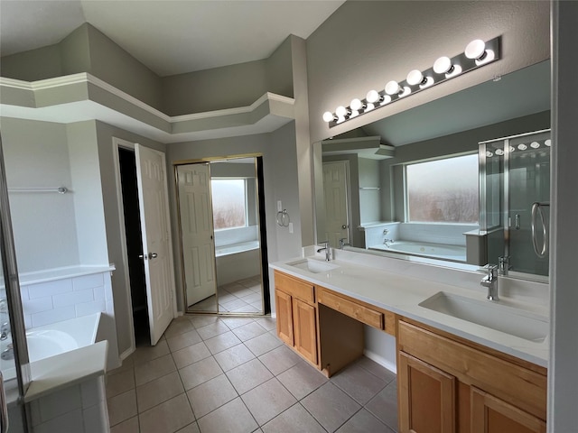 4400 Ripplewood Rd, Frisco, TX 75035 - full bath featuring a garden tub, double vanity, tile patterned floors, and a shower stall