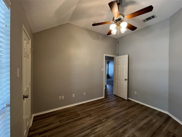 4400 Ripplewood Rd, Frisco, TX 75035 - empty room with dark wood-type flooring, a ceiling fan, lofted ceiling, and a textured ceiling