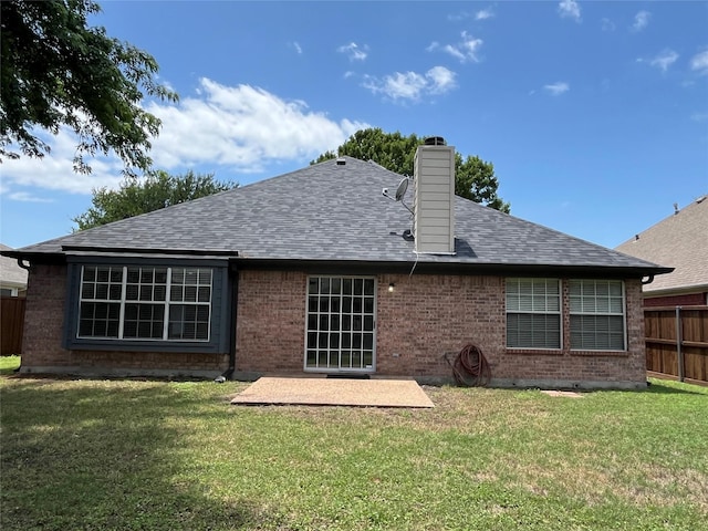 4400 Ripplewood Rd, Frisco, TX 75035 - rear view of property featuring a patio, a shingled roof, brick siding, and a chimney
