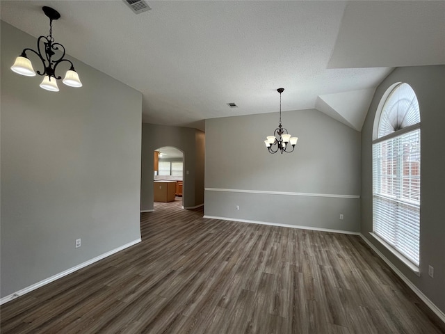 4400 Ripplewood Rd, Frisco, TX 75035 - unfurnished room with a chandelier, arched walkways, dark wood-style flooring, plenty of natural light, and lofted ceiling