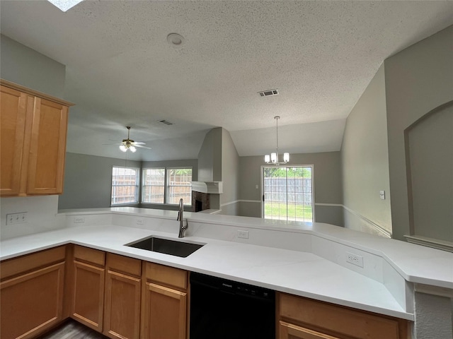 4400 Ripplewood Rd, Frisco, TX 75035 - kitchen featuring black dishwasher, a textured ceiling, light countertops, vaulted ceiling, and decorative light fixtures