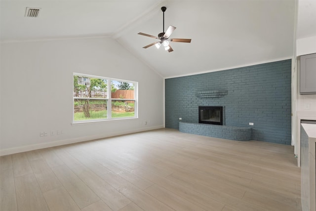 2024 Oakmeadow St, Bedford, TX 76021 - unfurnished living room featuring a brick fireplace, ceiling fan, light wood finished floors, and brick wall