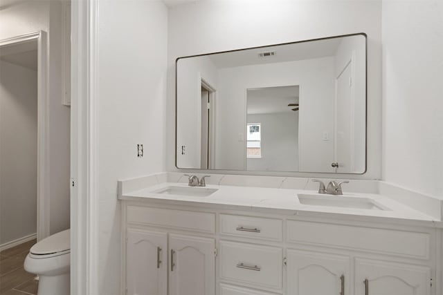 2024 Oakmeadow St, Bedford, TX 76021 - bathroom featuring double vanity and wood finished floors