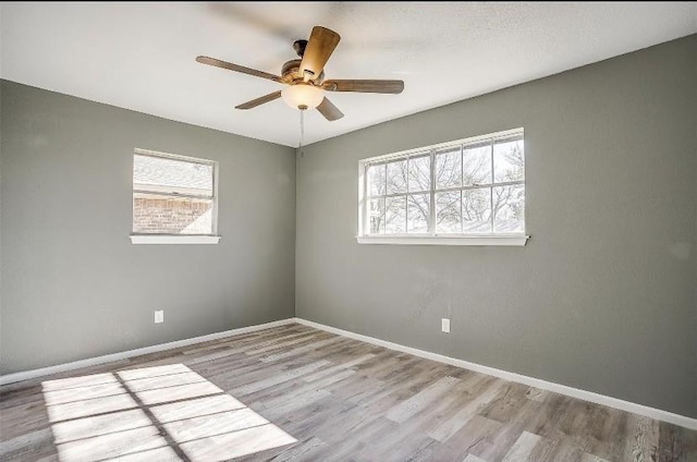 3501 NE 10th St, Mineral Wells, TX 76067 - empty room with wood finished floors and ceiling fan