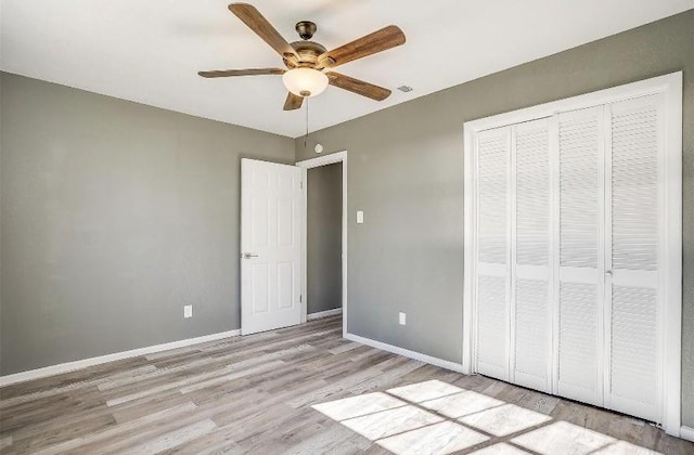 3501 NE 10th St, Mineral Wells, TX 76067 - unfurnished bedroom with wood finished floors, a closet, and ceiling fan