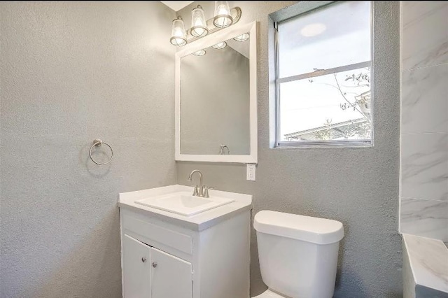 3501 NE 10th St, Mineral Wells, TX 76067 - bathroom featuring vanity and a textured wall