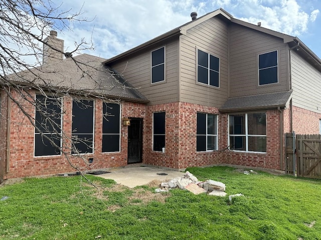 2011 Fair Oaks Cir, Corinth, TX 76210 - back of property with brick siding, a chimney, a patio area, and a gate