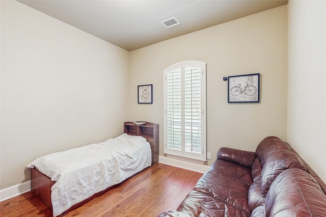 5768 Gallant Run, Frisco, TX 75033 - bedroom with wood finished floors and multiple windows