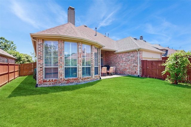 5768 Gallant Run, Frisco, TX 75033 - back of property featuring a fenced backyard, brick siding, a patio, a chimney, and roof with shingles