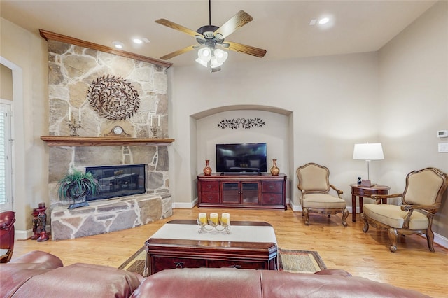 5768 Gallant Run, Frisco, TX 75033 - living room featuring wood finished floors, ceiling fan, a fireplace, and recessed lighting